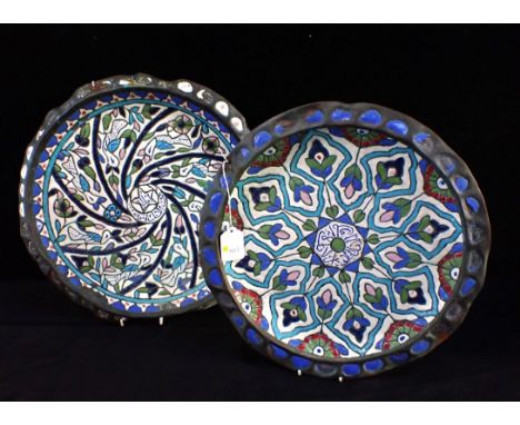 A PAIR OF IZNIK STYLE ENAMEL ON COPPER PLATESpierced for hanging 37cm dia (some damage)