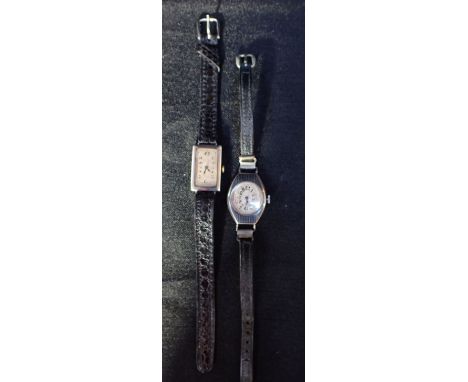 GOLDSMITH AND SILVERSMITH CO. LONDON: A LADIES' SILVER CASE WRISTWATCHwith manual wind movement, the white dial with black Ar