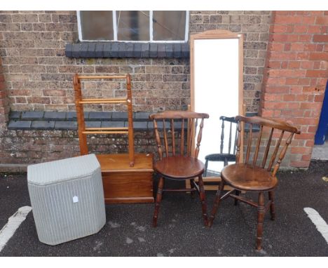 A PAIR OF ELM AND BEECH STICK-BACK CHAIRSwith circular seats, a small pine trunk 77cm wide, a Lloyd Loom laundry basket, a mo