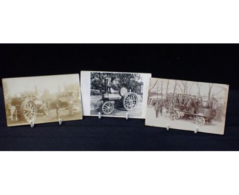 THREE EARLY POSTCARDS OF STEAM VEHICLESa traction engine, a steam lorry with soldiers and threshing