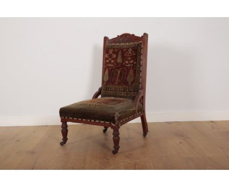 A VICTORIAN WALNUT FRAMED 'CARPET' CHAIRthe back and seat upholstered in antique Anatolian carpet pieces depicting Cypress tr