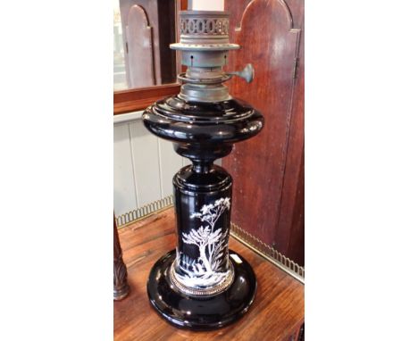 A 19TH CENTURY BLACK OPAQUE GLASS OIL LAMP: THE SILBER LIGHT COMPANYwith white enamelled decoration 'SILBER'S PATENT' burner 