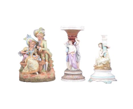 French painted Parian comport stand, damaged and incomplete, 32cm; a glazed candlestick formed as a seated female figure supp