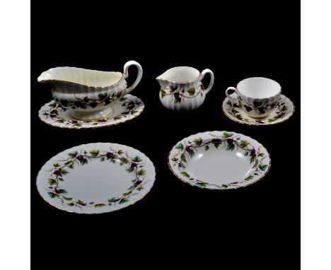 A Royal Worcester Bacchanal pattern part dinner and tea service, to include dinner plates, dessert plates, side plates, bowls