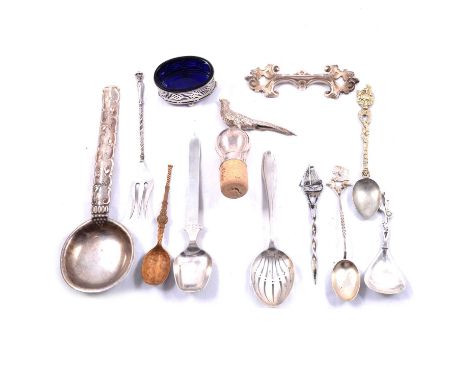A Dutch white metal pickle fork; sifter spoon; and knife; other Dutch white metal souvenir flatware; an imported silver wine 