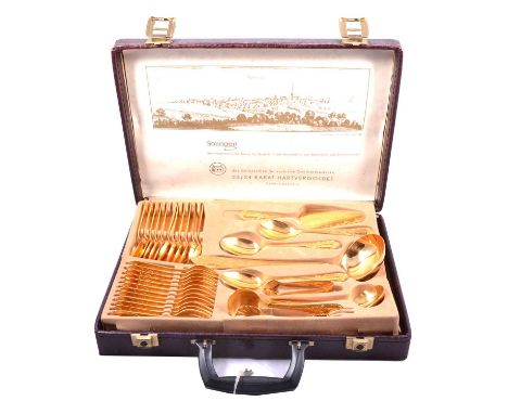 A Solingen gold-plated canteen of cutlery, 12 settings, in briefcase.
