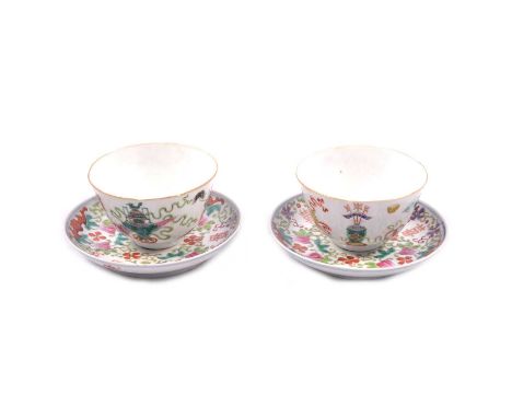 A pair of Chinese polychrome shallow bowls, red seal marks, with saucer dishes, blue seal marks, one damaged.Condition report