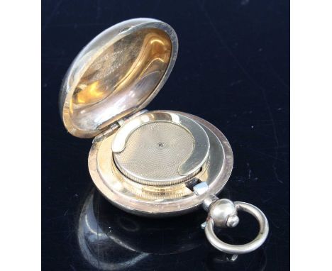 An early 20th century Dennison Watch Co. gold plated sovereign case, 5cm (including suspension ring), together with a brass s