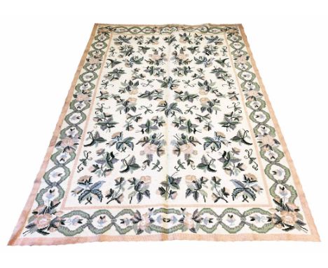 PORTUGUESE CARPET, 266cm x 176cm, repeat floral motifs on an ivory field within corresponding border.