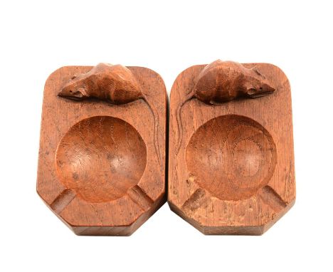 A pair of Robert 'Mouseman' Thompson oak ashtrays, each 10.5x7.5cm.Qty: 2