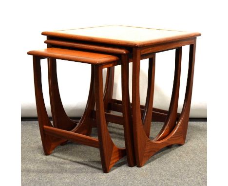 A nest of three teak G Plan tables with tile tops, 50x50cm, height 51cm and smaller.Qty: 3