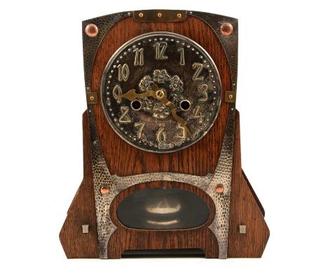 Arts and Crafts movement mantel clock, the movement by the Hamburg American Clock Co., striking a gong, shaped oak case mount