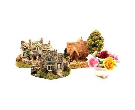 A collection of Lilliput Lane cottages; two Border Fine Arts groups, both on wooden stands; nine Royal Doulton Journey Throug