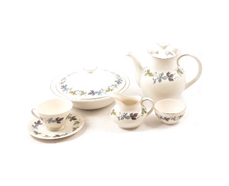 A Royal Doulton 'Burgundy' pattern part dinner and tea service, to include lidded tureens, meat platters, dinner plates, side