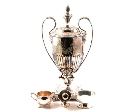 A Walker &amp; Hall silver plated tea urn, half fluted with floral swags, the circular foot on a square base with four ball f