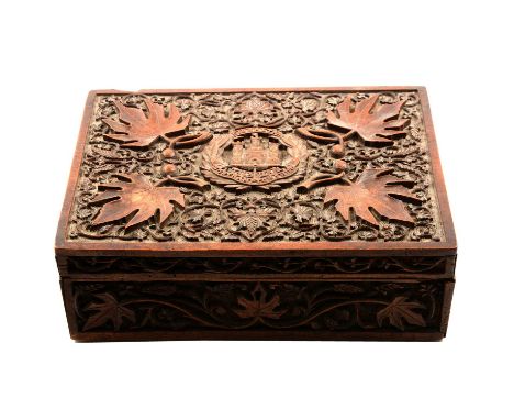 Northamptonshire Regiment - a carved wooden box with regimental crest to top (possibly Indian), 27x19x9cm, a framed embroider