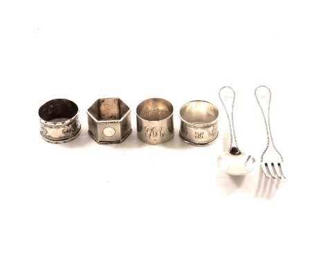 Four silver napkin rings, engine turned and engraved, two with personal engravings; a Victorian silver bead edge fork and spo