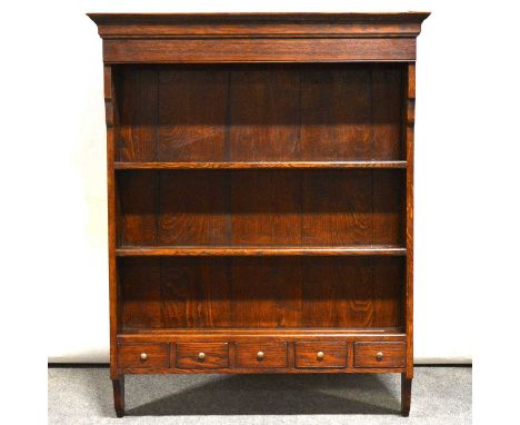 Haselbech Oak delft rack, moulded cornice, panelled back with two shelves above five spice drawers, width 99cm, height 122cm.