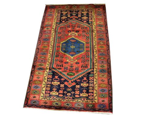 Hamadan rug, blue central medallion on a pole, contained within a large lozenge with burnt orange ground, navy filed, enclose