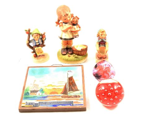 A Caithness Congratulations glass paperweight; a Caithness Pebble glass paperweight; a Wedgwood apple paperweight; a Paul Mil