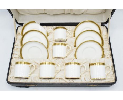 Cased Minton coffee set to include 6 cups and 6 saucers decorated with a Grecian Key style design (one plate and one saucer d