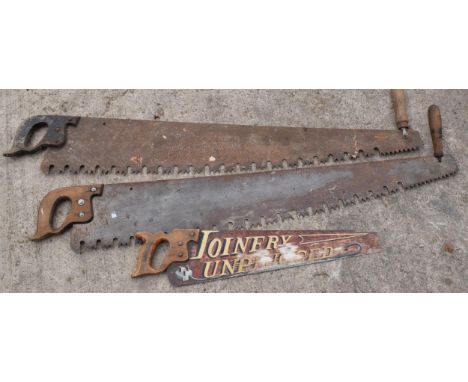 A trio of vintage wooden and metal saws to include two two-man saws and small painted example (3), longest approx 120cm. Coll