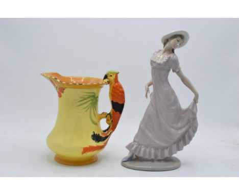 Burleigh Art-Deco jug with cockatoo handle together with Nao figure of a girl wearing a bonnet (2).  In good condition with n