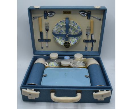 A 1960s/70s Brexton picnic set in blue case to include flasks, cutlery and crockery (one side missing otherwise believed comp