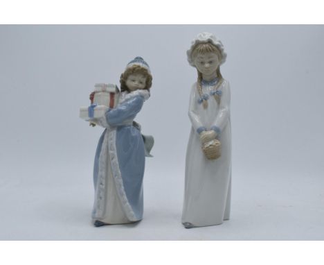 A pair of Nao by Lladro figures of girls in traditional clothing, 26cm tallest.  In good condition with no obvious damage or 