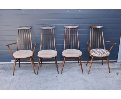 A set of 4 mid century Ercol spindle-back chairs to include 2 arm chairs (4). 97cm tall.  Age-related wear and scuffs to incl