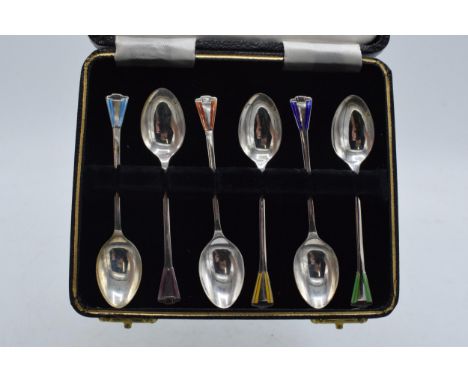 A cased set of 6 silver teaspoons with coloured enamel decoration, 38.3 grams / 1.23 oz. Birmingham 1947.  