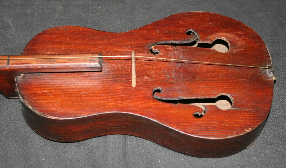 GUSTLE/FIDDLE An antique 1 stringed instument known as a Gustle, or 1