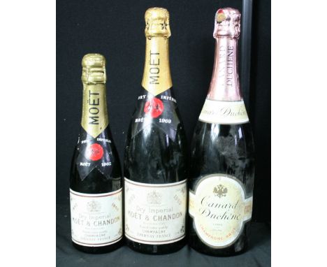 CHAMPAGNE - three bottle of vintage champagne to include a 1969 Moet & Chandon Dry Imperial (70cl), a 1962 half bottle of Moe