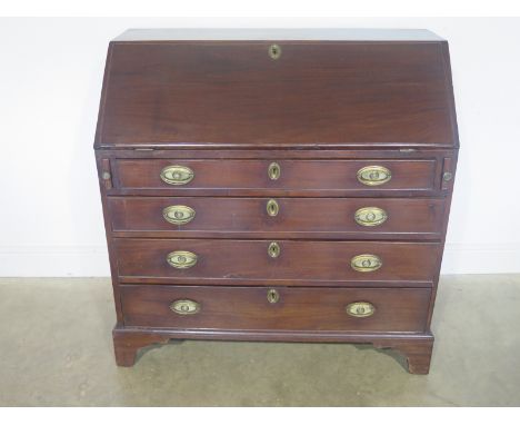 A Georgian mahogany bureau with a fitted interior above four long graduating drawers on bracket feet - Height 106cm x 106cm x
