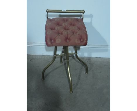 A 19th century brass cello stool with a button seat bought in 1984 for £184