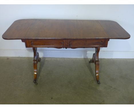 A 19th century mahogany sofa table with an active and dummy drawer to each side on outswept supports - Height 74cm x 64cm x 1