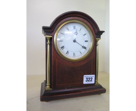 An Edwardian mahogany and inlaid mantle clock