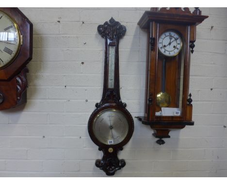 A carved oak wheel barometer by Gardner & Co Glasgow, the scale marked 28 to 31 with thermometer above - Height 92cm Conditio