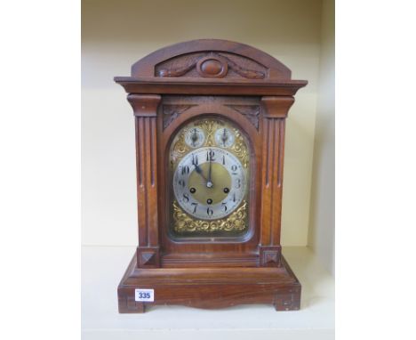 A 19th century oak case bracket clock with three train movement with quarter chimes - Height 45cm