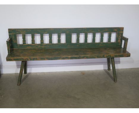 A European pine bench with original green paint on hand cut legs - Width 190cm