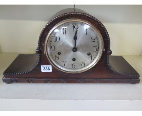 An oak case mantle clock with quarter Westminster chimes - 8 day movement