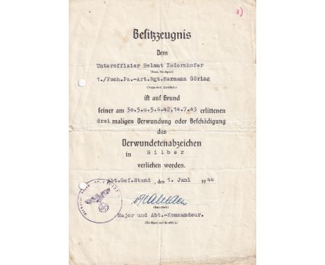 A German Second World War Hermann Goring Paratrooper Award Document.  A standard A5 size citation, folded twice, punch holed 