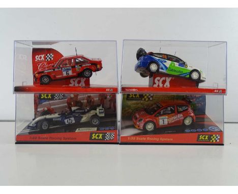A group of 1:32 scale slot racing cars by SCX to include Rally and Formula 1 examples - VG/E in G/VG boxes (4)