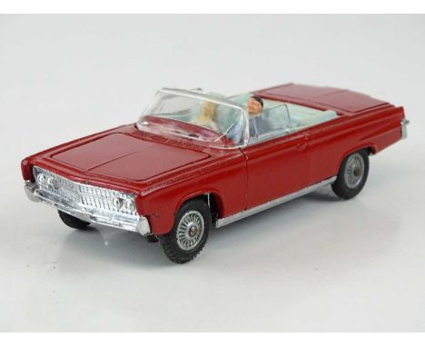 A CORGI 246 Chrysler Imperial in red with pale blue interior, with passengers and golf trolley - VG in G/VG box