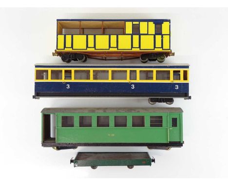 A group of scratchbuilt G scale narrow gauge (32mm) bogie coaches in various liveries (one bogie detached but present - see p