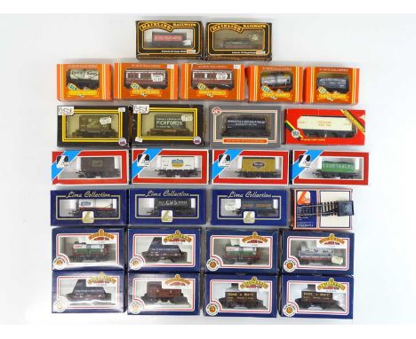 A group of OO Gauge boxed wagons and coaches by BACHMANN, LIMA, DAPOL, HORNBY and MAINLINE - G/VG in G boxes (27)