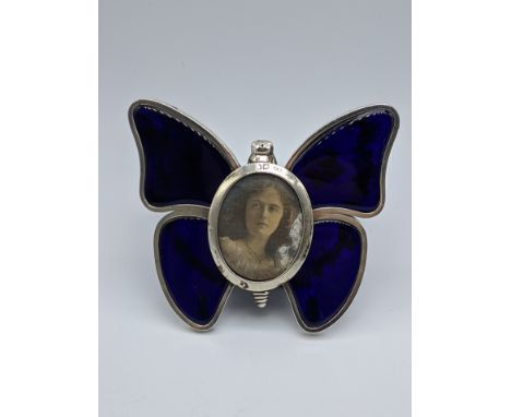A late Victorian silver and enamel butterfly photo frame, hallmarked London, maker Henry Stuart Brown, H.9cm W.11cm