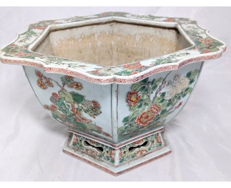 A large Chinese Famille Verte hexagonal jardiniere, Kangxi period (1662-1722), each side decorated with The Flowers of the Fo