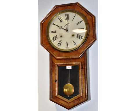 AN AMERICAN DROP DIAL WALL CLOCK with 8-day movement, the painted dial with subsidiary seconds dial, in walnut case, paper la