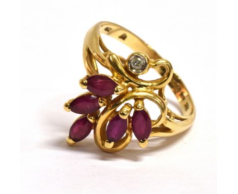 A RUBY AND DIAMOND SET 14CT GOLD RING Five marquise cut rubies and a small diamond to organic style wire work head, size N, g